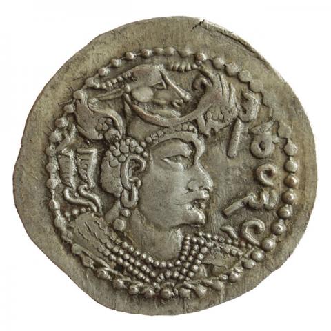 Bust with winged bull's head crown and crescent moon; corrupted Nezak legend