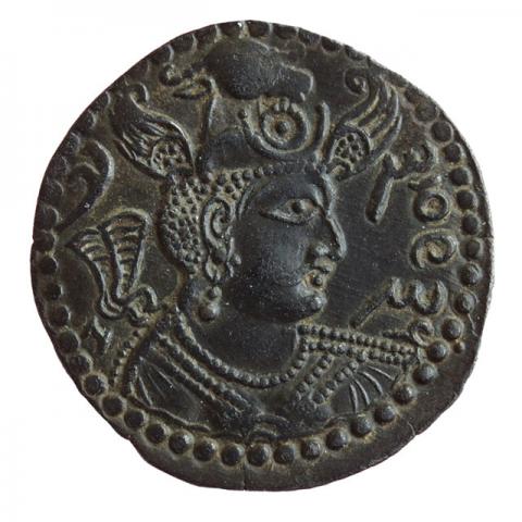 Bust with winged bull's head crown, within a circle; corrupted Nezak legend