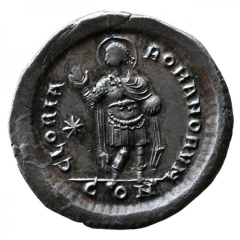 Emperor with nimbus standing, right hand raised, a globe in the left hand
