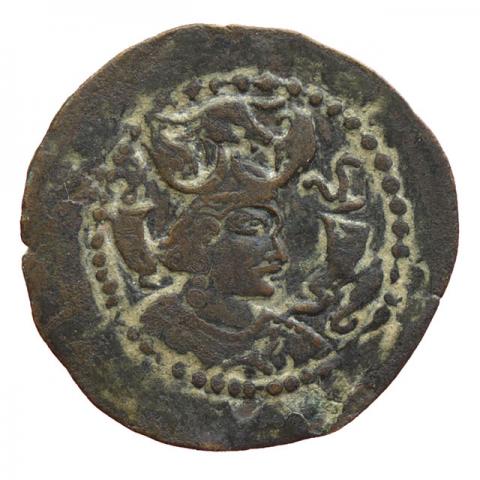 Bust with winged bull's head crown and two crescent moons; right tamga