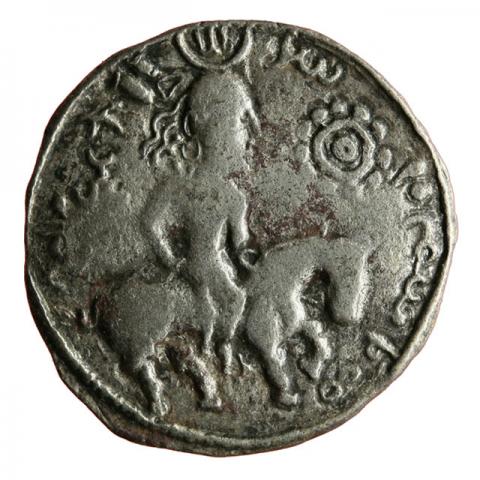 Crowned rider, right rosette; Bactrian inscription "Zabocho, King of the East"