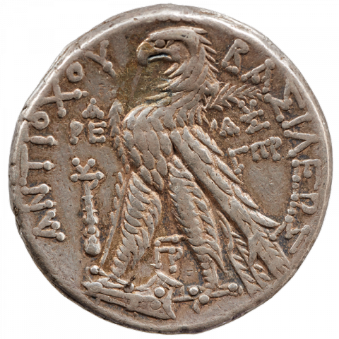 Eagle on prow, left: club; Greek: BAΣIΛEΩΣ - ANTIOXOY, ΓΠP ([coin of] king Antiochus, year 183)